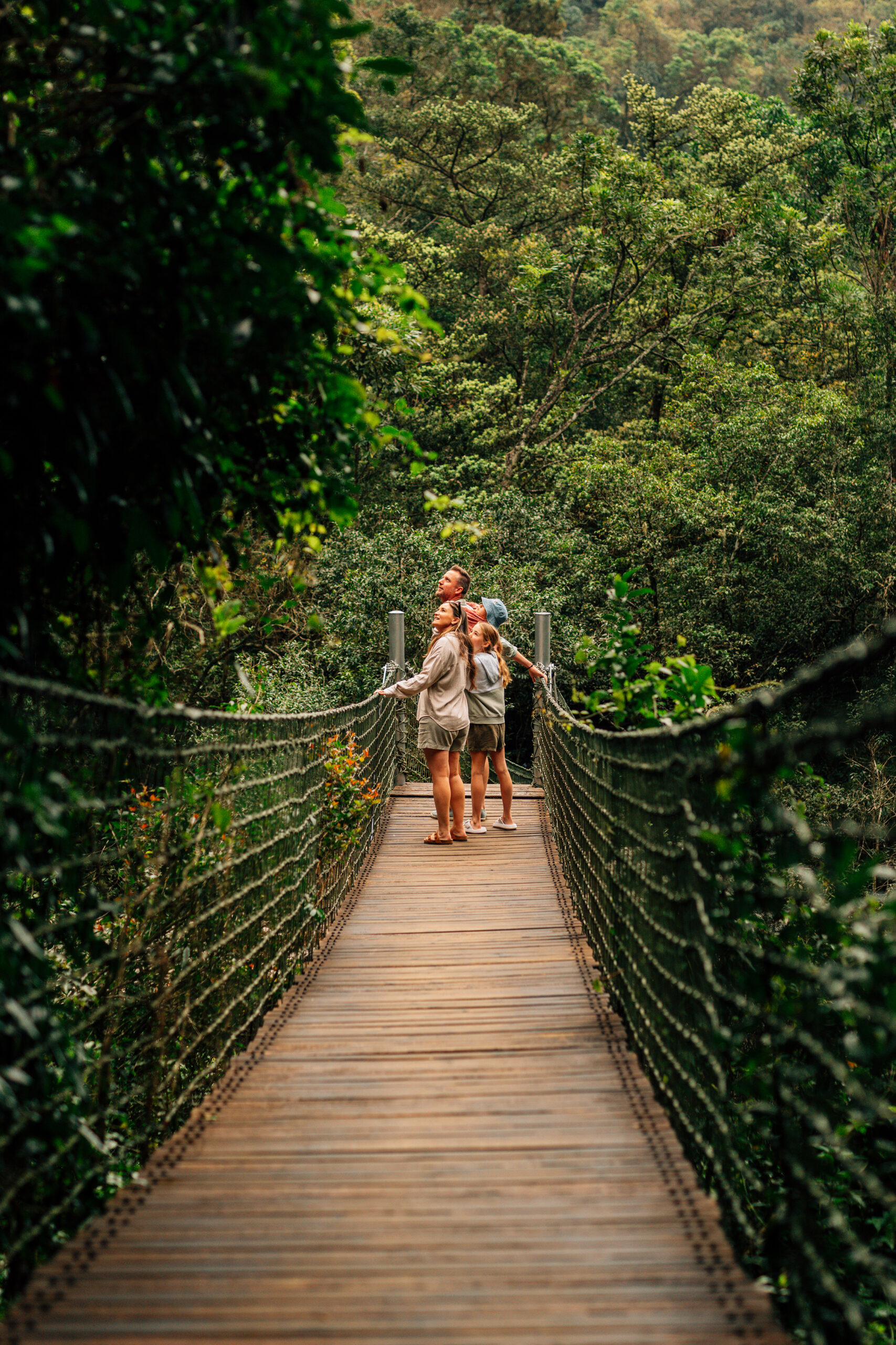 Shiviko Kruger family on bridge in forest scaled